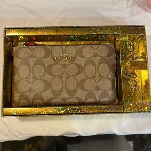 Coach Signature Lg Tan/Red Wristlet w/ 2 Gold Holiday Charms  NIB